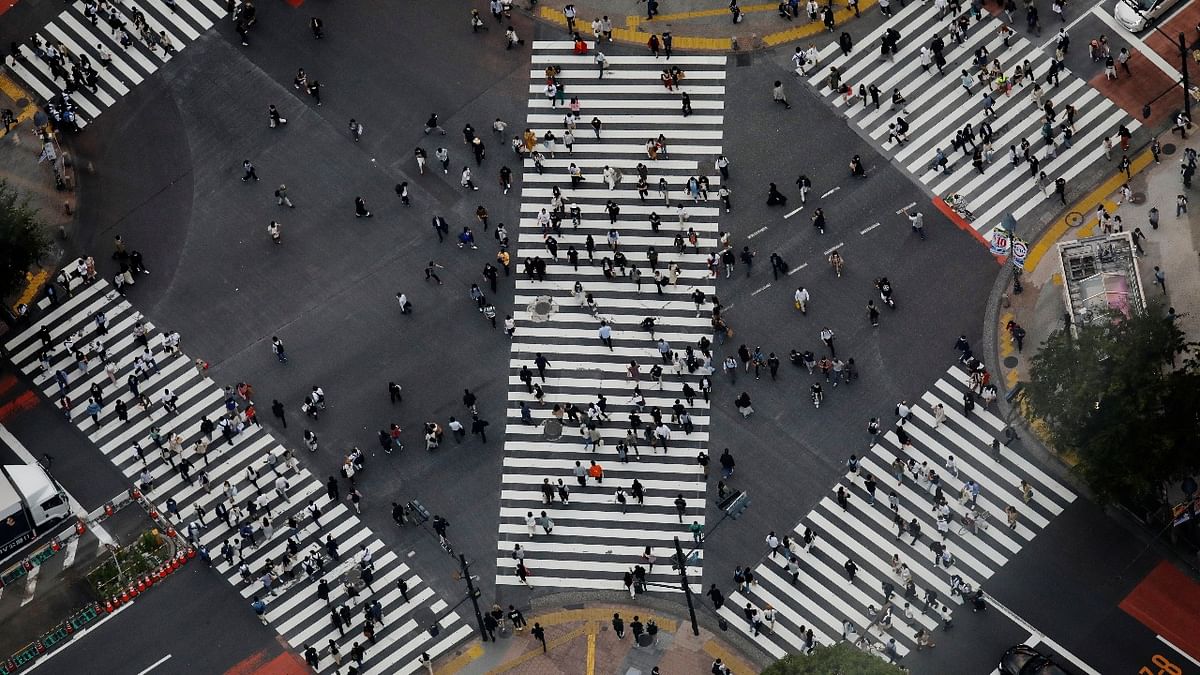 People walk across the Shibuya crossing in Tokyo, Japan. Credit: Reuters photo