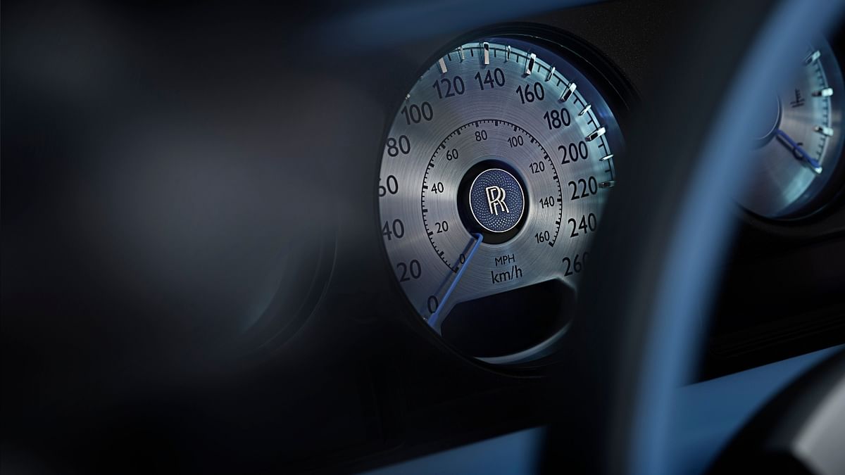 Guilloché patterning (used on luxury watch dials) graces the analog speedometer and other instrument panels.