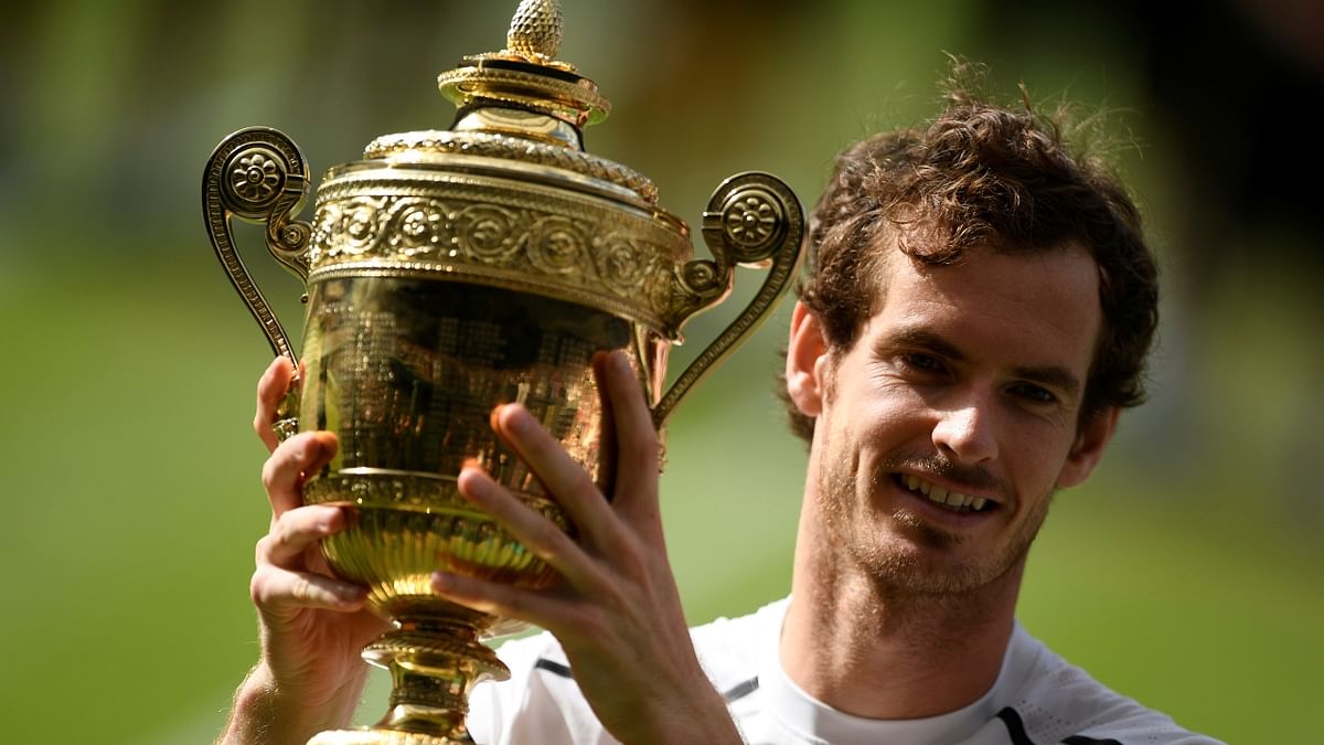 Murray, who had captured his maiden Slam title at the US Open in 2012, became Britain's first Wimbledon men's champion since Fred Perry in 1936. Murray defeated world number one Novak Djokovic 6-4, 7-5, 6-4. Before climbing into the player's box to celebrate with his family, Murray had turned towards the press box. Credit: Reuters Photo