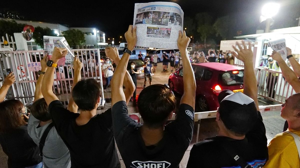 Emotions ran high as supporters of the paper, which has faced an unrelenting squeeze since its owner and staunch Beijing critic, Jimmy Lai, was arrested under the security law in August 2020, queued for their last copies just after midnight. Credit: AFP Photo