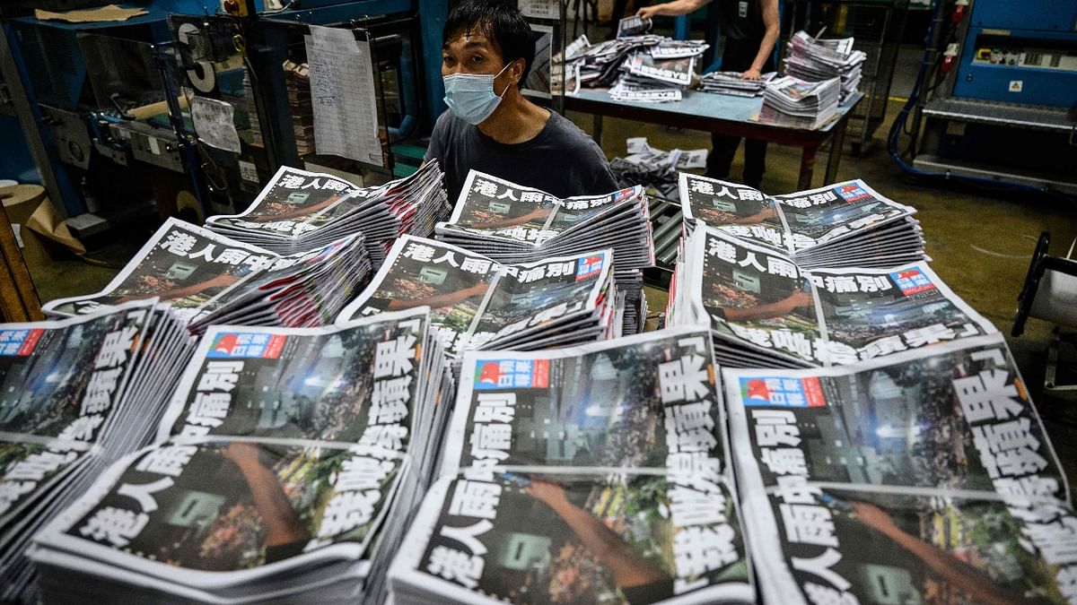 In anticipation of robust demand for its final print run, Apple Daily, which mixes pro-democracy views with celebrity gossip and investigations of those in power, printed 1 million copies, or more than 10 times its usual print run. Credit: AFP Photo