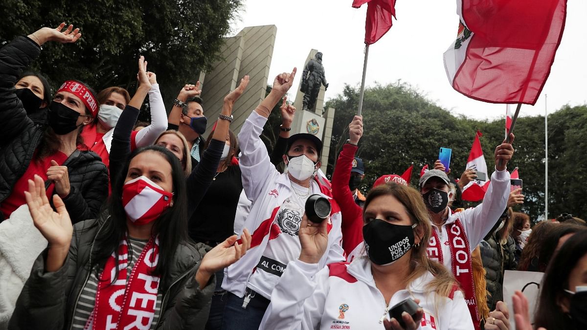 Retired military personnel and supporters of Peru's conservative candidate Keiko Fujimori protest against socialist candidate Pedro Castillo, in Lima, Peru. Credit: Reuters photo