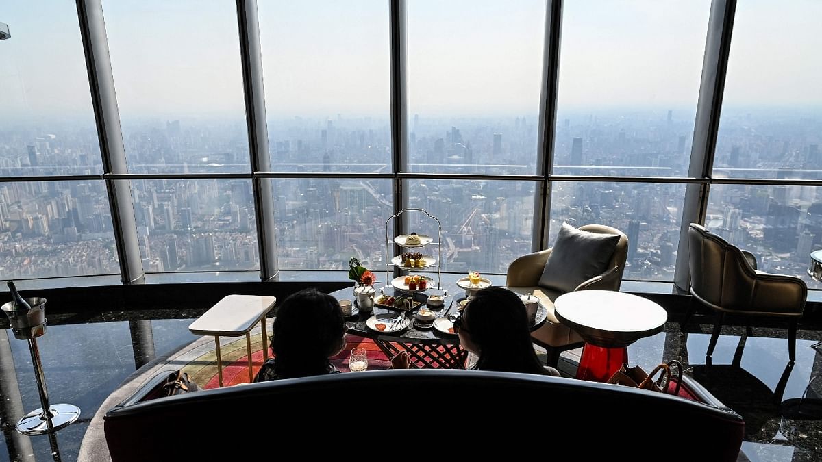 Guests are seen in the J Hotel, the world's highest luxury hotel, boasting a restaurant on the 120th floor and 24-hour personal butler service, located in the Shanghai Tower, in Shanghai.