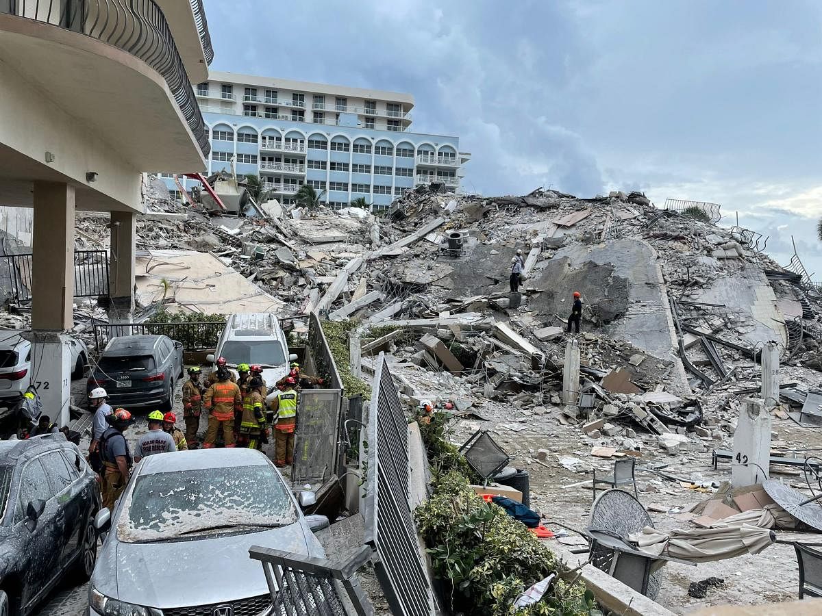 This handout image courtesy of the Miami-Dade Fire Rescue shows the partially collapsed building in Surfside, north of Miami Beach, Florida. Credit: AFP Photo