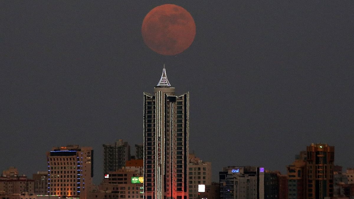 The last super moon of the year rises above Kuwait City. Credit: AFP Photo