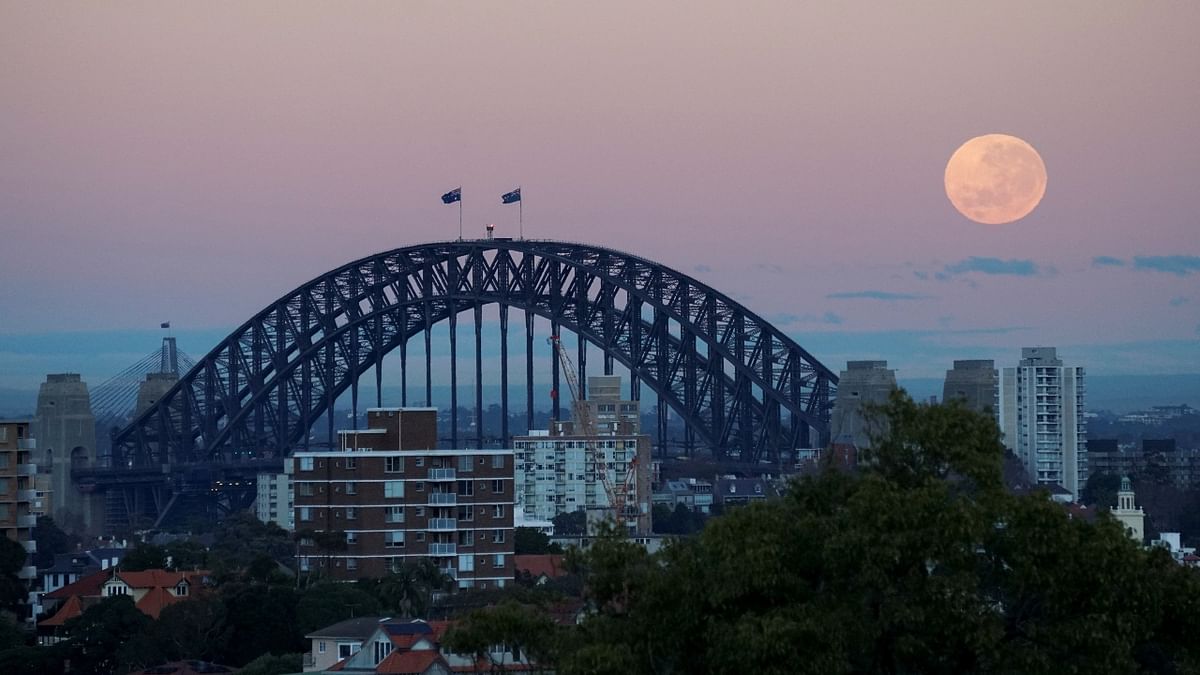 The 'Strawberry Moon' over Sydney Harbour Bridge in Sydney, Australia. Credit: Reuters Photo