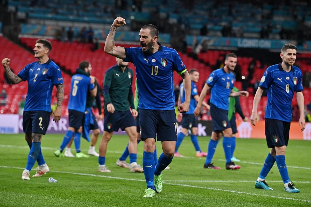 Italy's defender Leonardo Bonucci (C) and teammates celebrate their win after extra-time in the UEFA EURO 2020 round of 16 football match between Italy and Austria at Wembley Stadium in London. Credit: AFP Photo