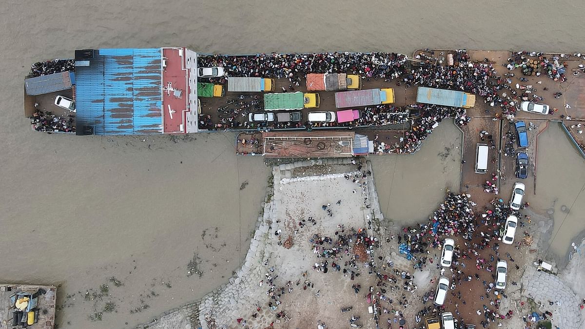 An aerial view of people boarding a ferry in Munshiganj.