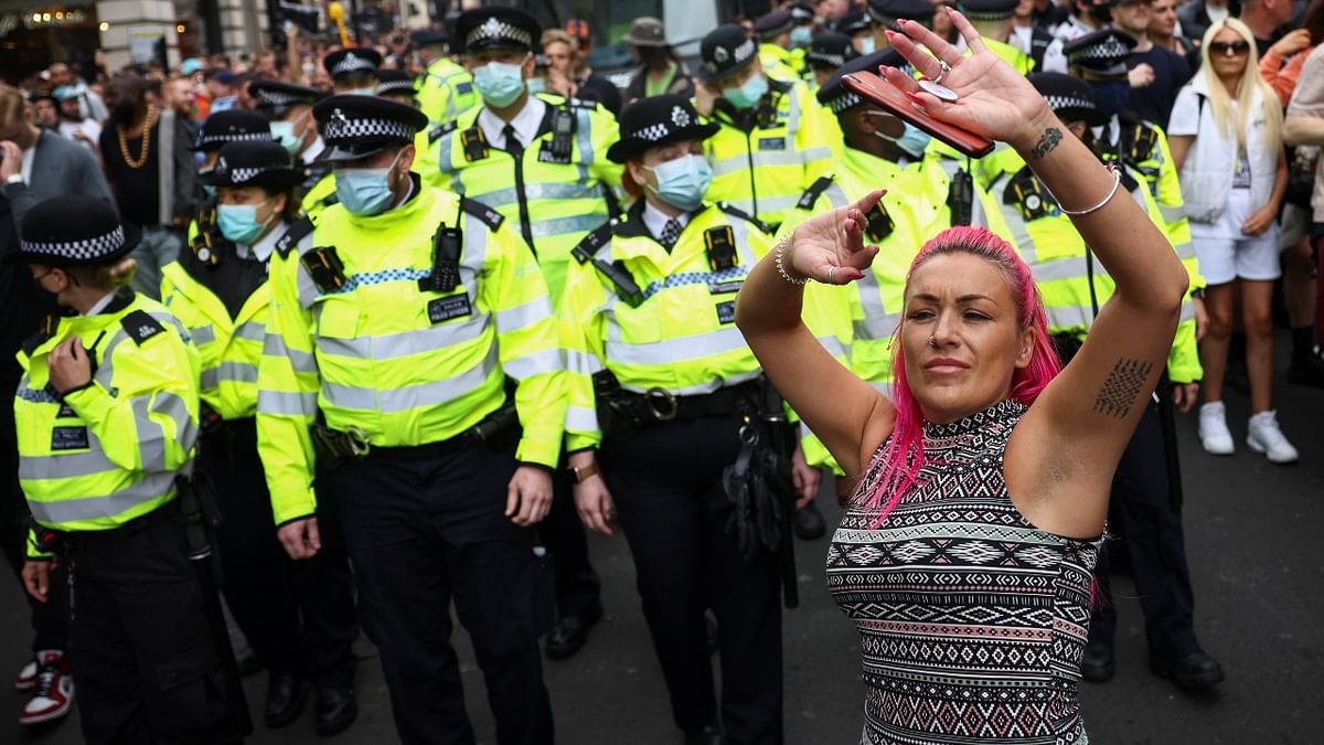 Thousands of anti-lockdown protesters marched through central London and the prime minister's Downing Street residence and parliament were pelted with tennis balls.