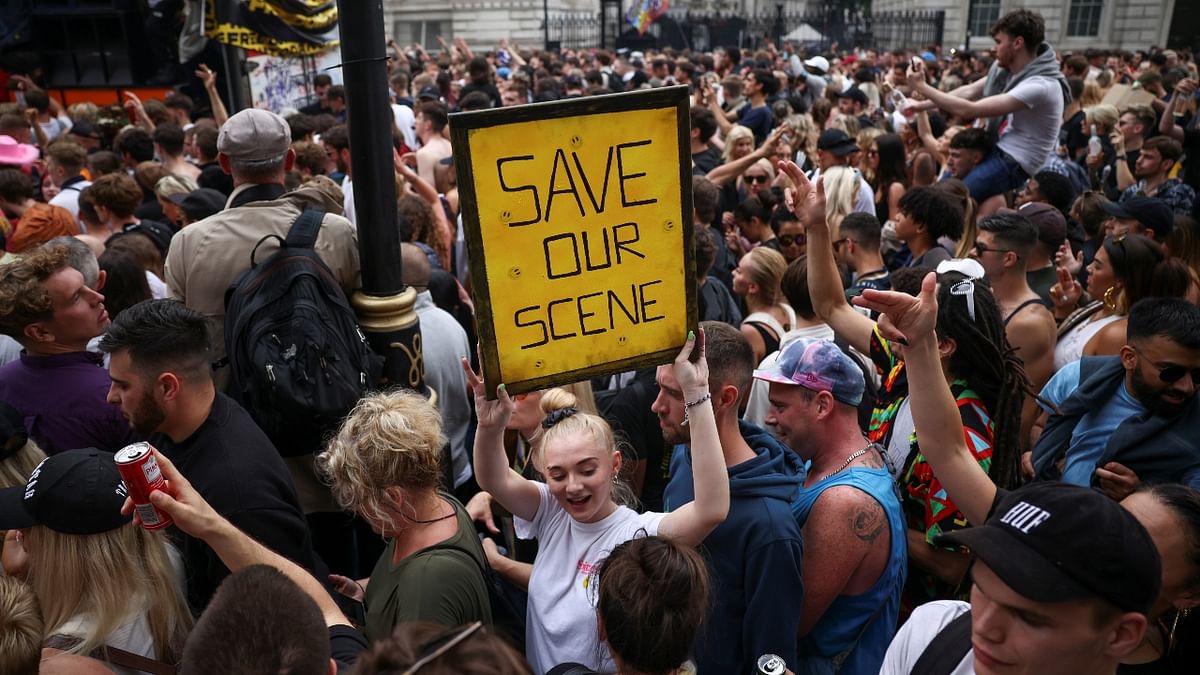 Demonstrators raise slogans during the 'Save Our Scene' protest, amid the Covid-19 pandemic, in London.