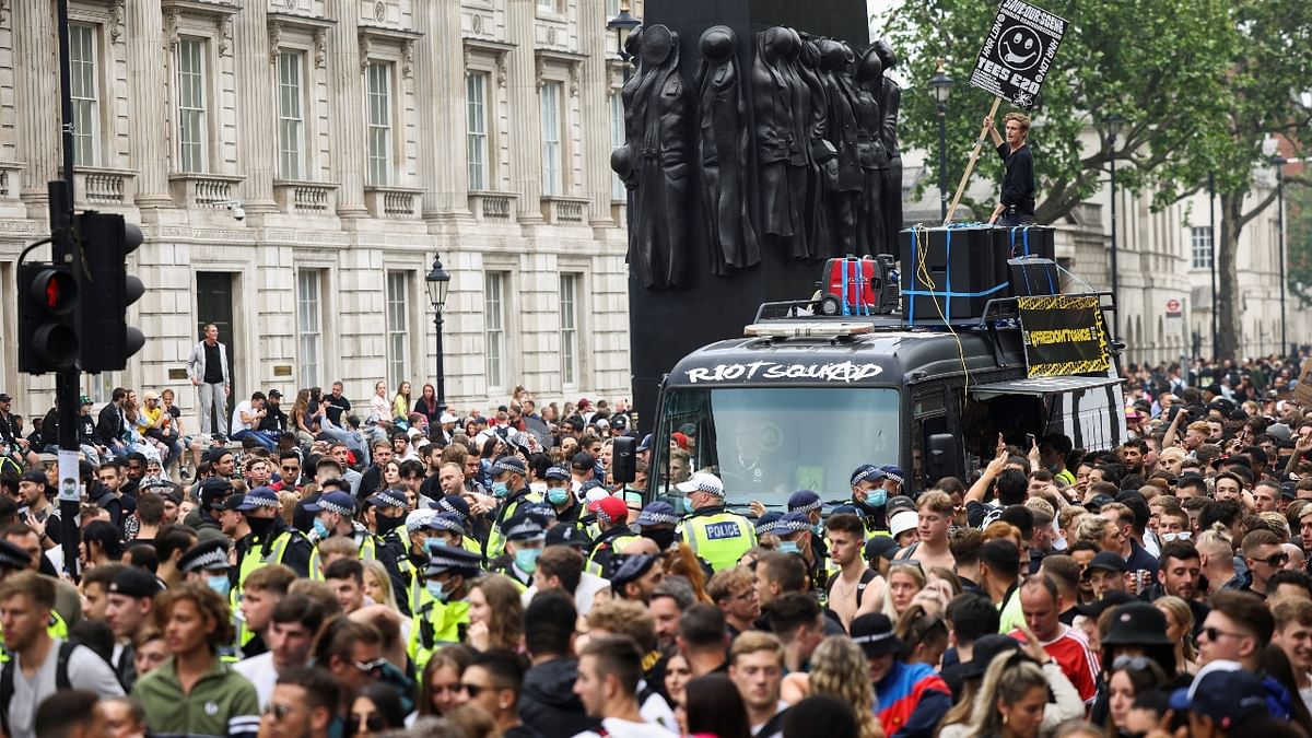 Thousands of protestors gather at Downing Street during the 'Save Our Scene' protest in London.