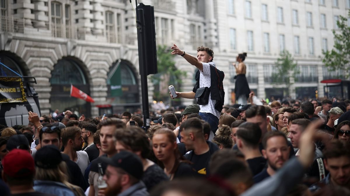 Demonstrators raise slogans during the 'Save Our Scene' protest in London.