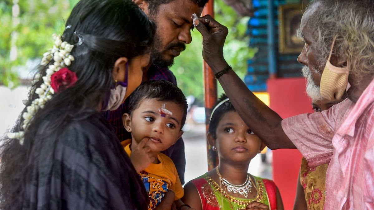 Devotees pray at a temple after its re-opening during the ongoing Covid-19 lockdown, in Chennai. Credit: PTI Photo