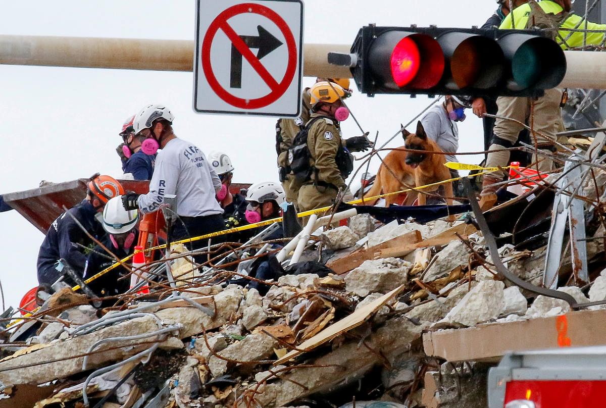 Emergency workers conduct search and rescue efforts at the site of a partially collapsed residential building in Surfside, near Miami Beach, Florida. Credit: Reuters Photo