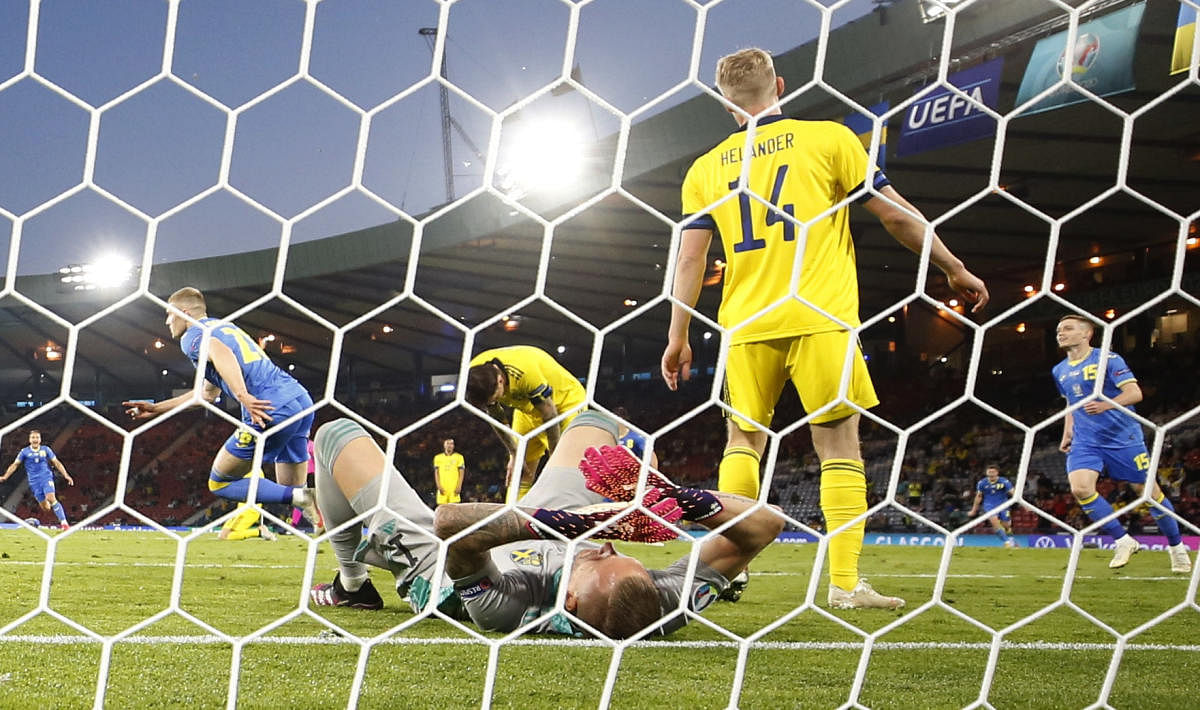 Sweden's Robin Olsen reacts after Ukraine's Artem Dovbyk scores their second goal. Credit: Reuters Photo