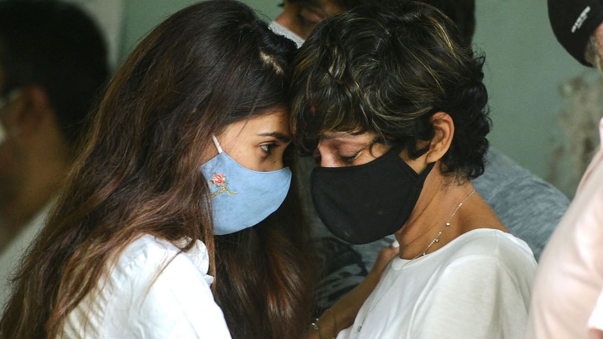 A well-wisher is seen consoling the grieving Mandira Bedi during Raj Kaushal’s funeral in Mumbai. Credit: AFP