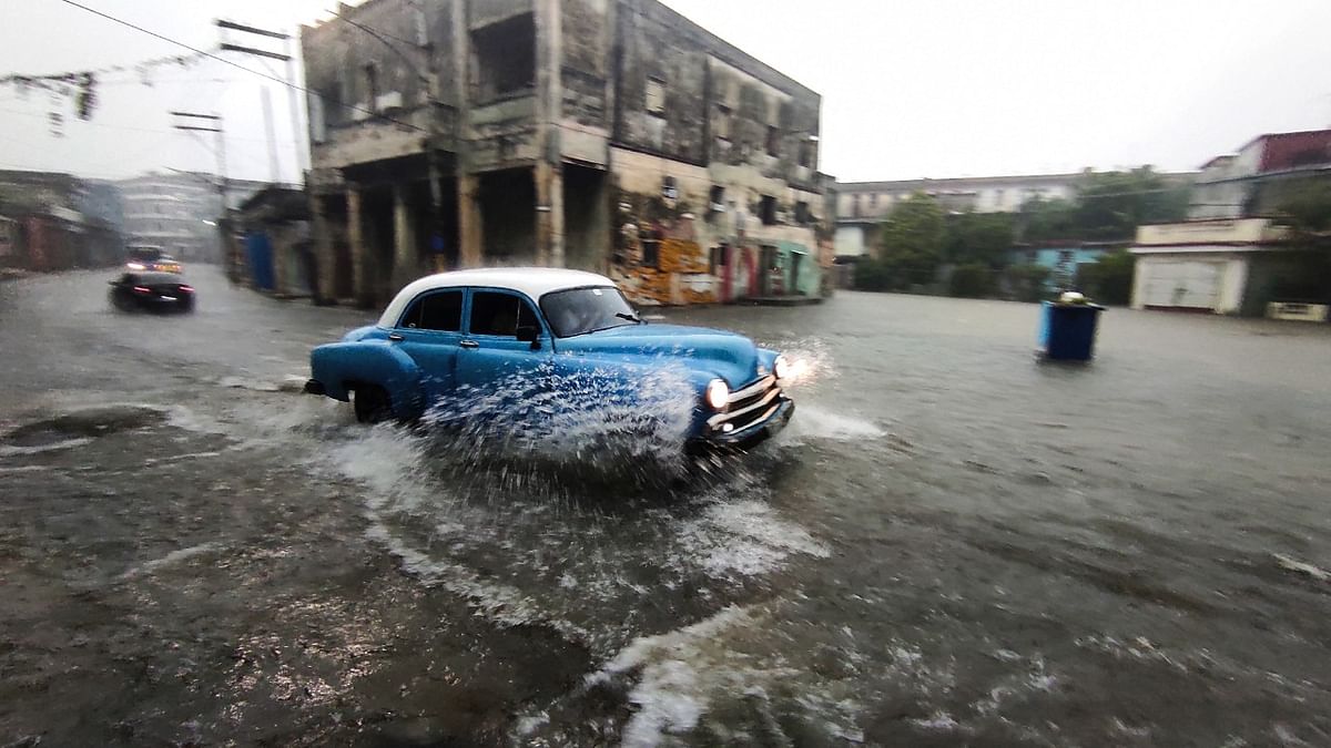 Heavy rains and malfunctioning sewers cause the flooding of streets in Havana. Credit: AFP Photo