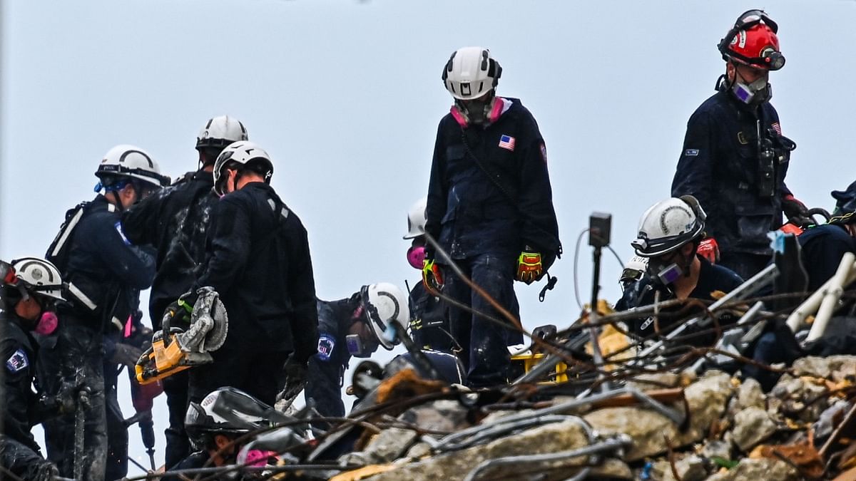 Four more bodies were discovered overnight in the rubble of a collapsed apartment building in Florida, authorities said Wednesday, as the search for more than 140 people unaccounted for entered its seventh day. Credit: AFP Photo