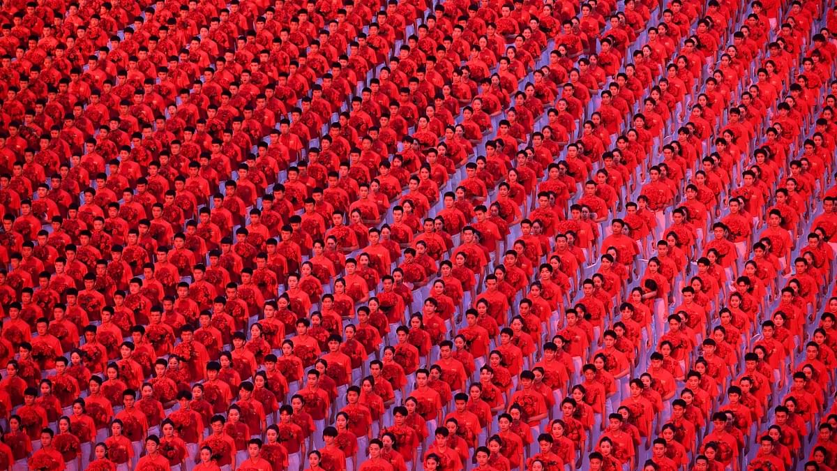 To mark the 100th anniversary ceremony of the Chinese Communist Party (CCP), the crowd was bussed in throughout the night to pass through rigorous security and health checks. Credit: AFP Photo