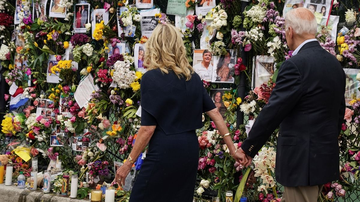US President Joe Biden and first lady Jill Biden visit a memorial put in place for the victims of the building collapse in Surfside, in Tent city area, Surfside, Florida. Credit: Reuters Photo