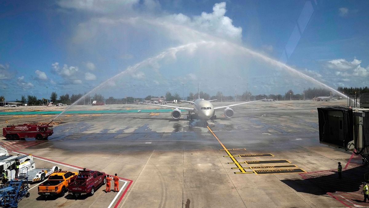 As the first flight arrived, airport fire trucks blasted their water canons to form an arch over the Etihad jet from Abu Dhabi as it taxied to its gate.