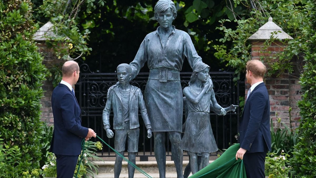Britain's Prince William, Duke of Cambridge and Britain's Prince Harry, Duke of Sussex unveil a statue of their mother, Princess Diana at The Sunken Garden in Kensington Palace, London.