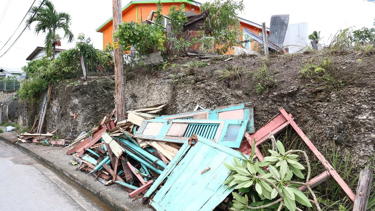 Debris from a house lie next to a road after strong winds of Hurricane Elsa passed St. Michael, Barbados. Credit: Reuters Photo