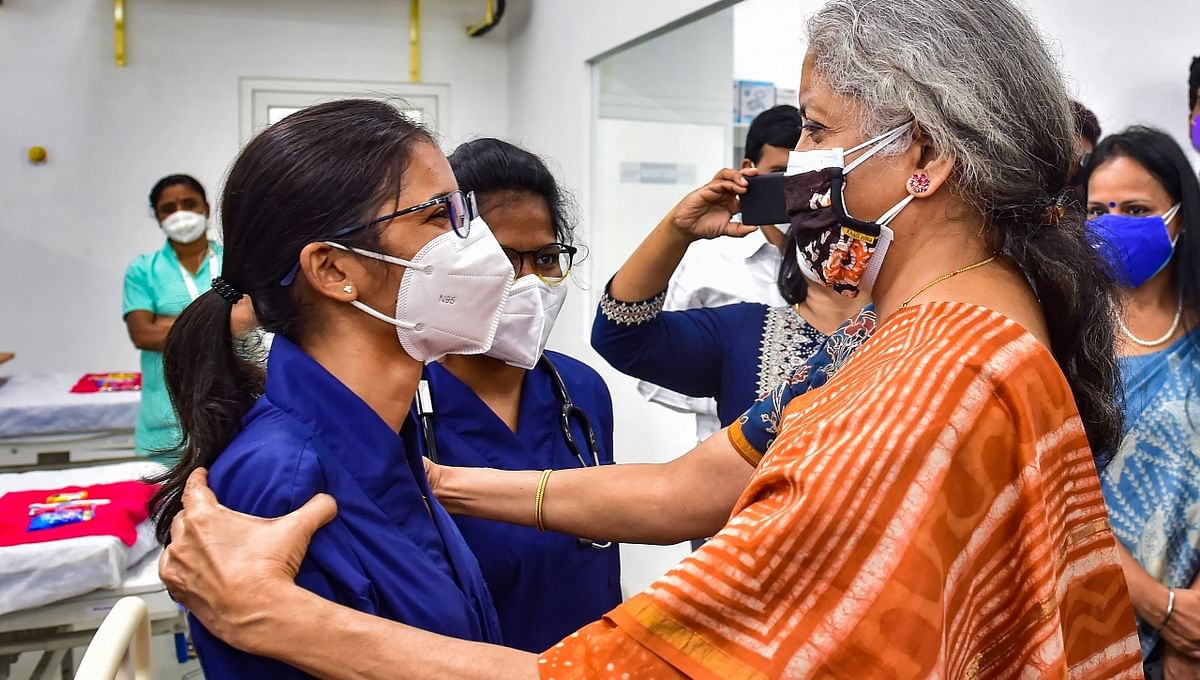 Pictured: Sitharaman talks to a nurse during her visit to the Covid Care facility at Yelahanka in Bengaluru.