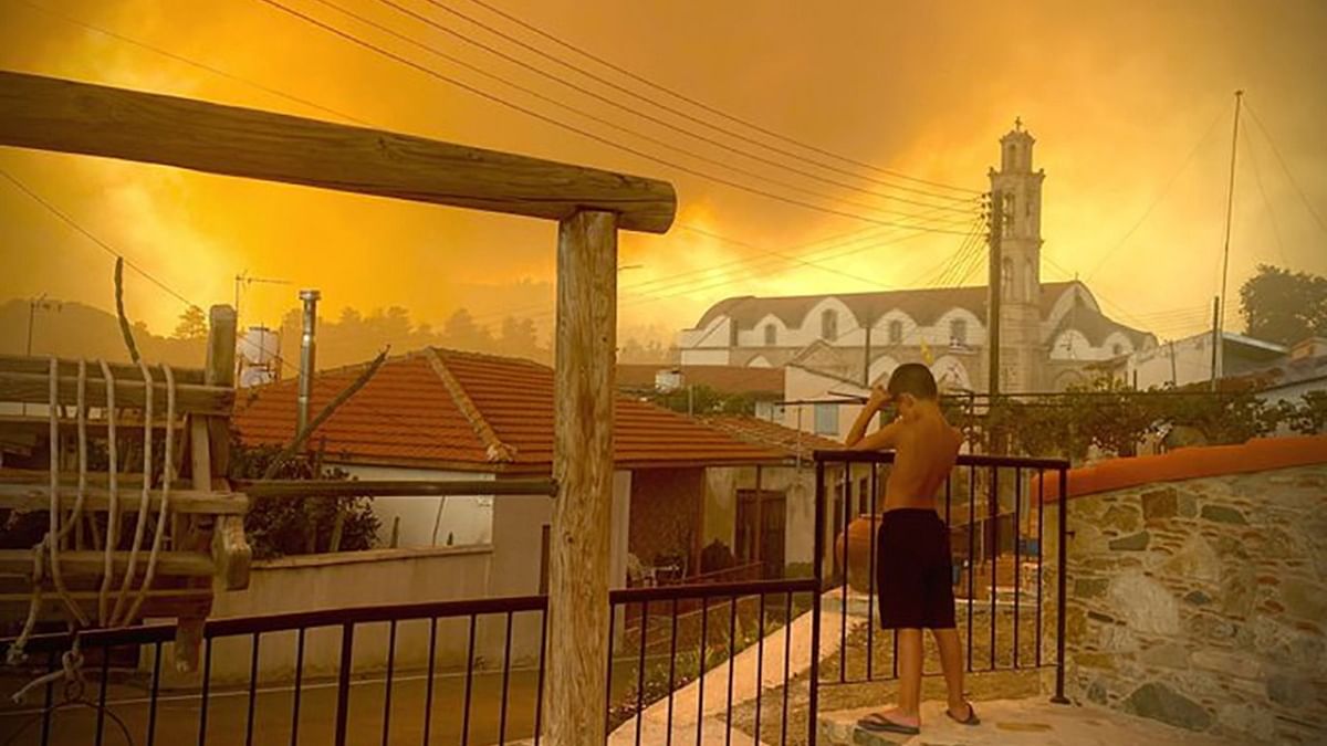 Smoke from a forest fire is seen in Ora village, Larnaca, Cyprus, July 3, 2021, in this picture obtained from social media. Credit: ANDREA ANASTASIOU/via Reuters