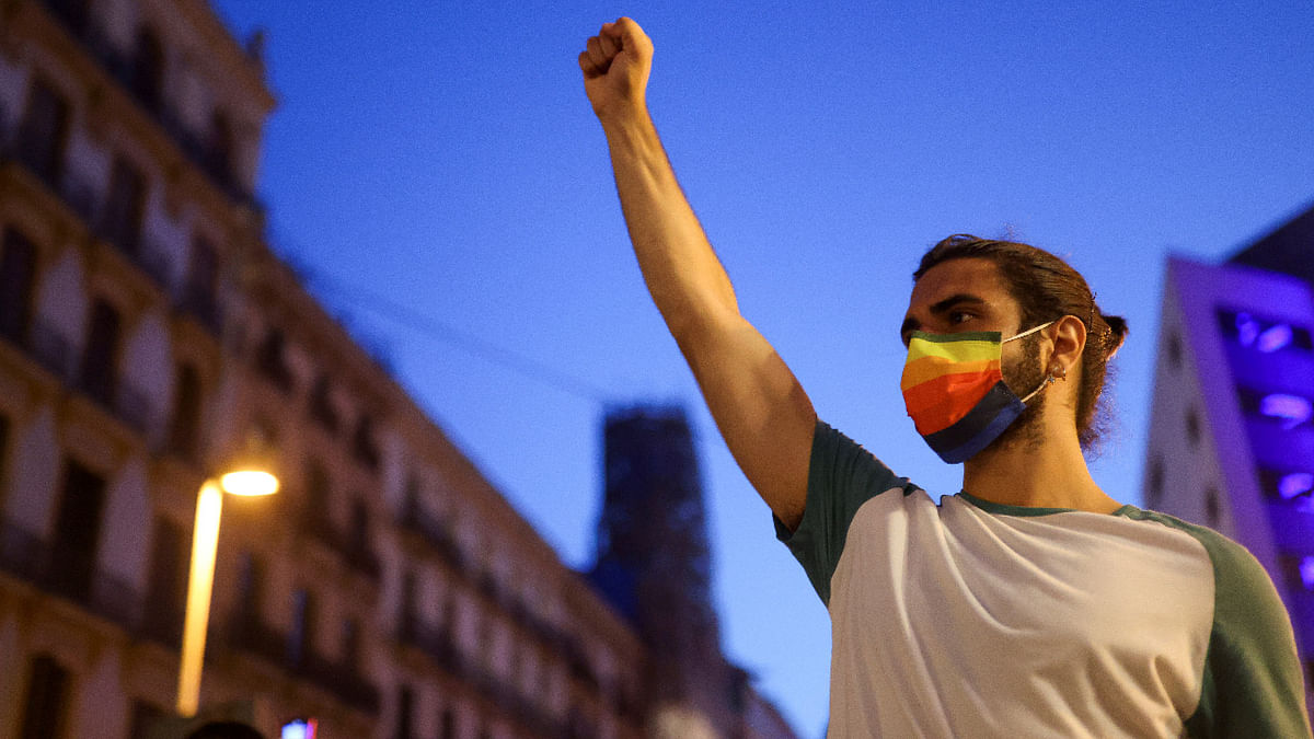 An LGBT+ activist gestures during a protest over the death of Samuel Luiz, who was attacked outside a club in A Coruna, in Barcelona. Credit: Reuters Photo