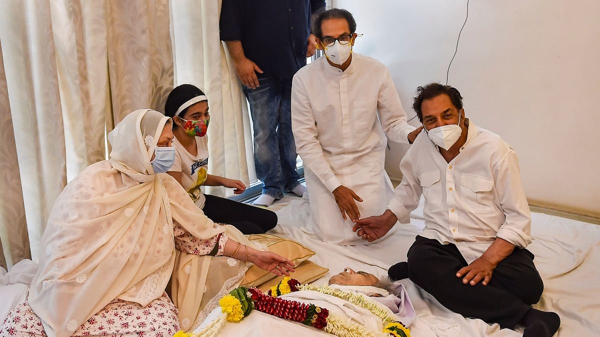 Chief Minister Uddhav Thackeray and Dharmendra pay their last respects. Credit: PTI Photo