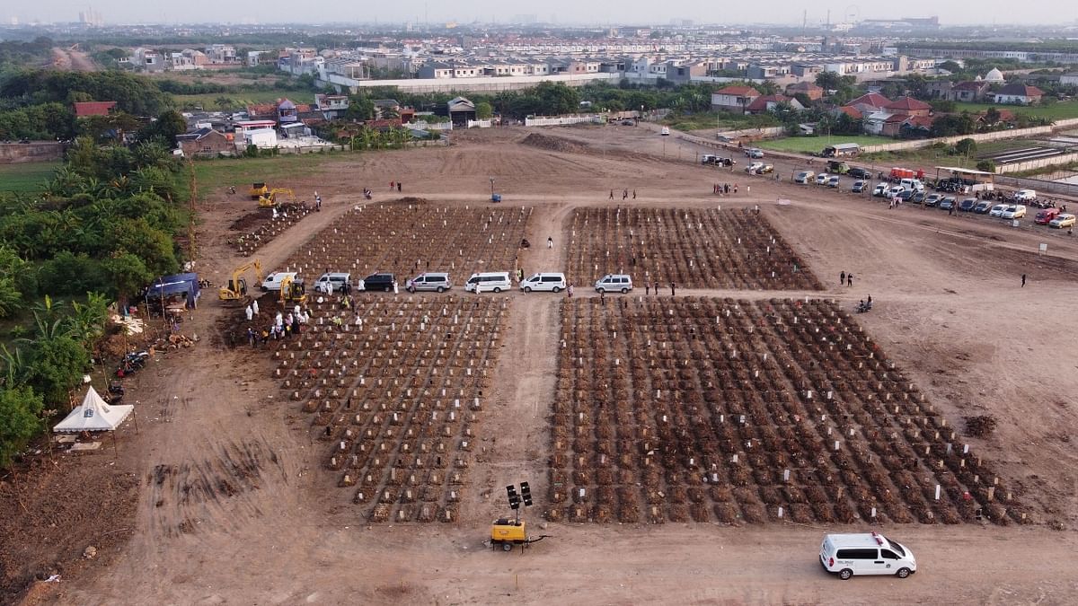 The aerial footage shows a huge brown clearing cut from a lush green field, rows of identical and newly filled plots. Credit: Reuters Photo