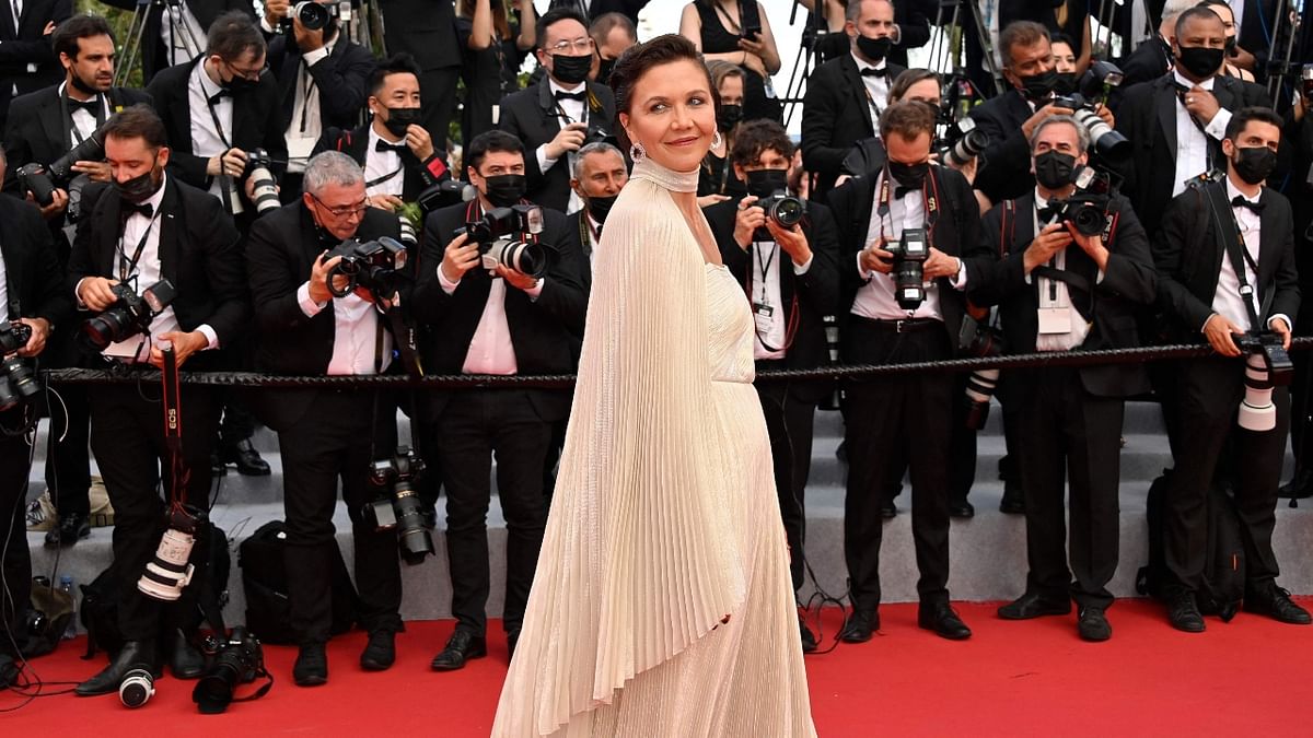 Maggie Gyllenhaal looked elegant in an off-white silk dress per Celine by Hedi Slimane. Credit: AFP Photo