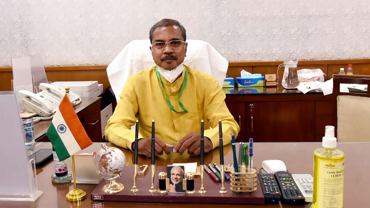 Dr. Munjapara Mahendrabhai at his office as the Minister of State for Women and Child Development.