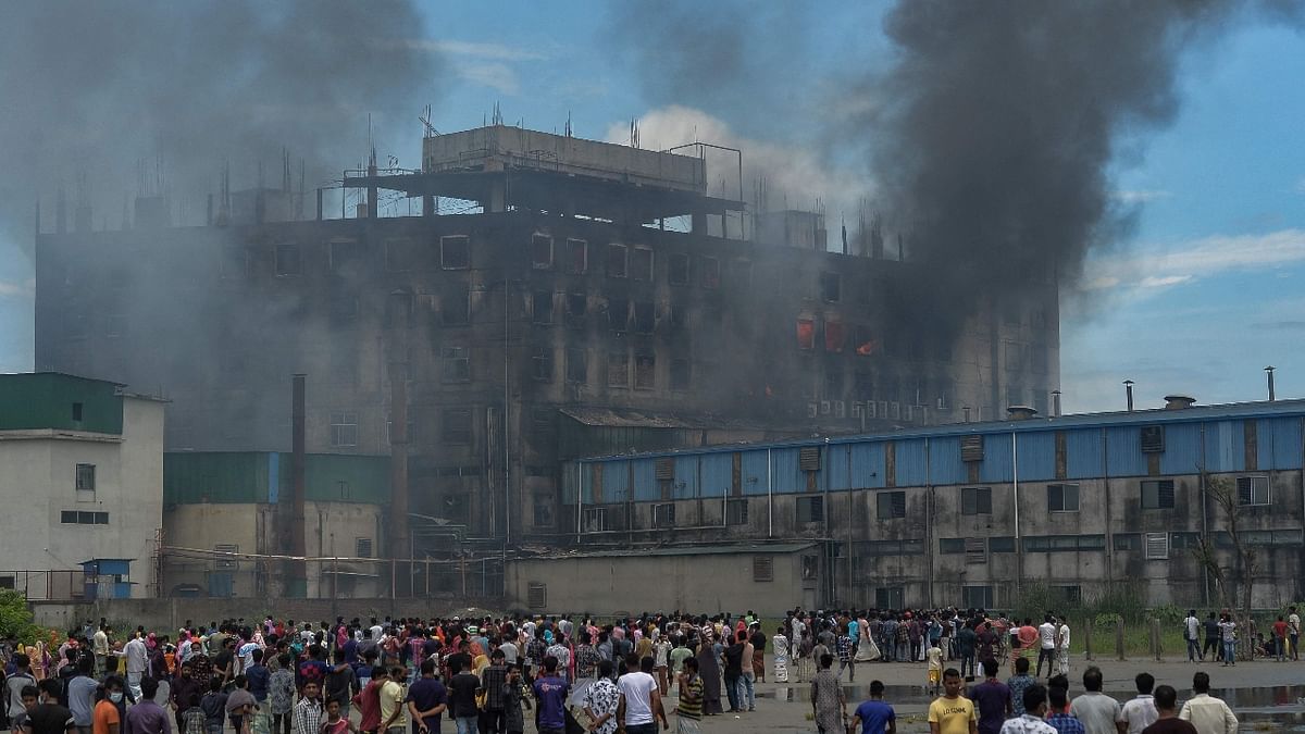People gathered in front of the building in search of their loved ones. Of the many missing, the identities of 44 workers have been confirmed, the newspaper said. Credit: AFP Photo