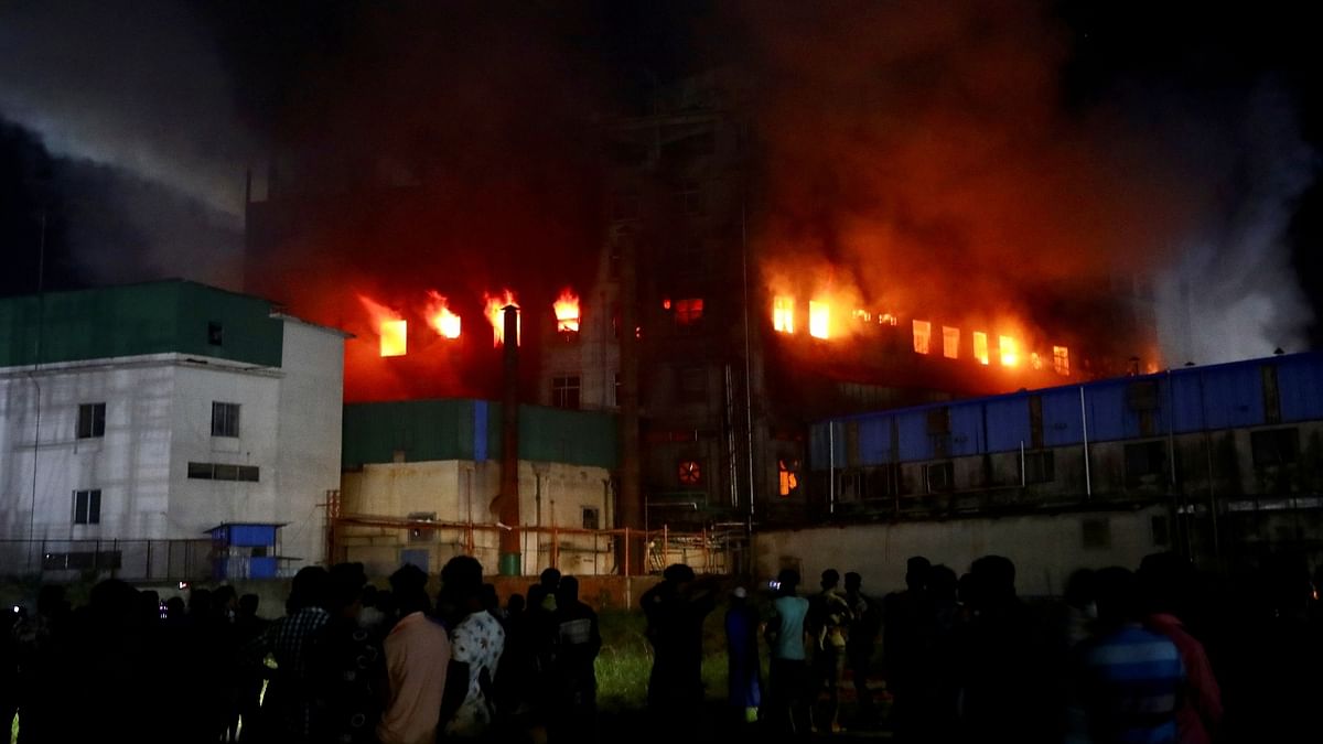 18 firefighting units were struggling to douse the fire at the factory building of Hashem Foods Limited. Credit: Reuters Photo