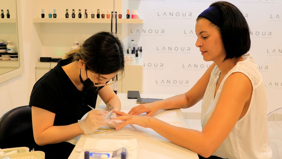 A customer is seen getting a microchip manicure at Lanour Beauty Lounge in Dubai, United Arab Emirates.