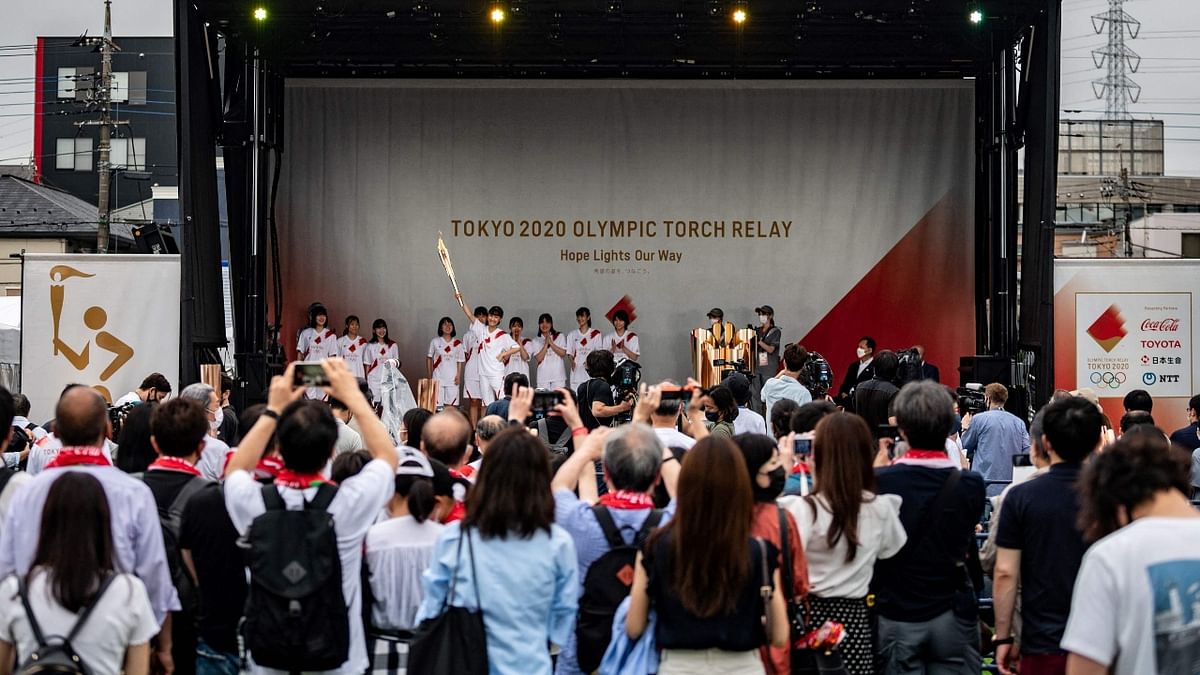 In a taste of what is to come for thousands of athletes who will compete at the pandemic-delayed Games, the public was kept away from the arrival of the flame and a welcoming ceremony was attended only by the media and officials. Credit: AFP Photo