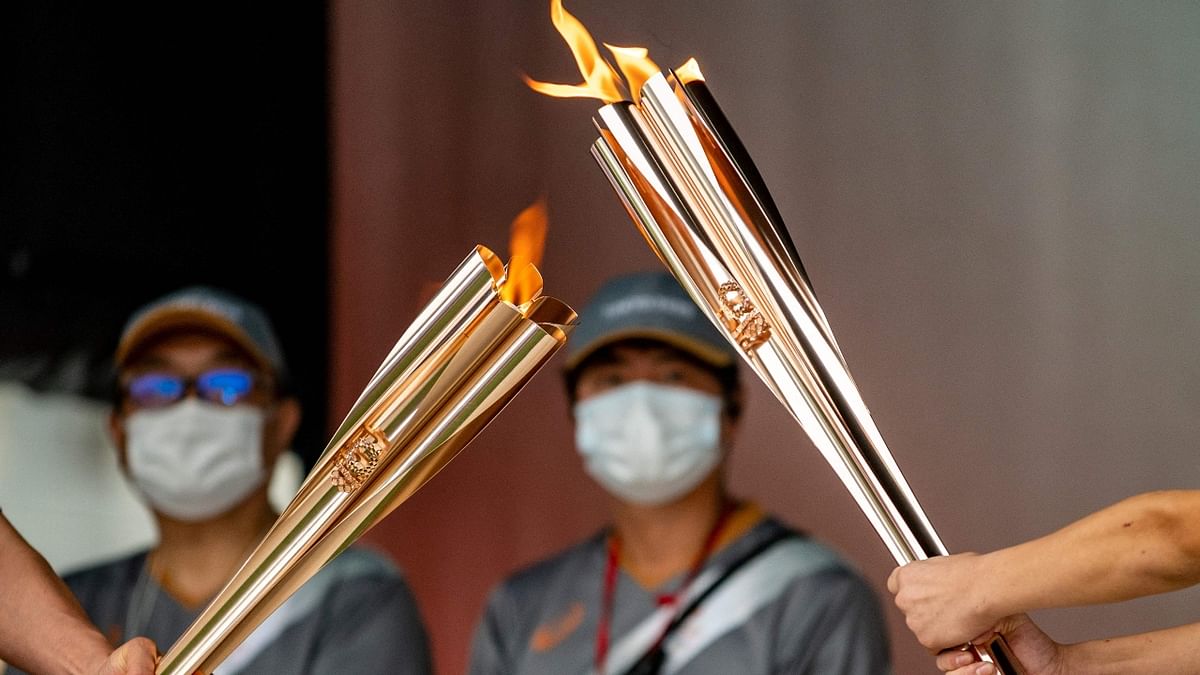 The nationwide torch relay was supposed to stoke excitement about the Games, but almost half the legs have been taken off public roads or otherwise altered because of virus concerns. Credit: AFP Photo