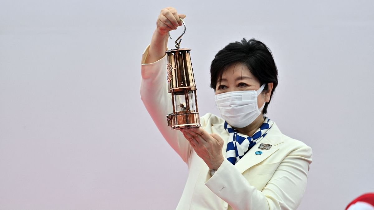 In Tokyo, Governor Yuriko Koike received the Olympic flame in a lantern at a ceremony in an empty stadium. Credit: AFP Photo