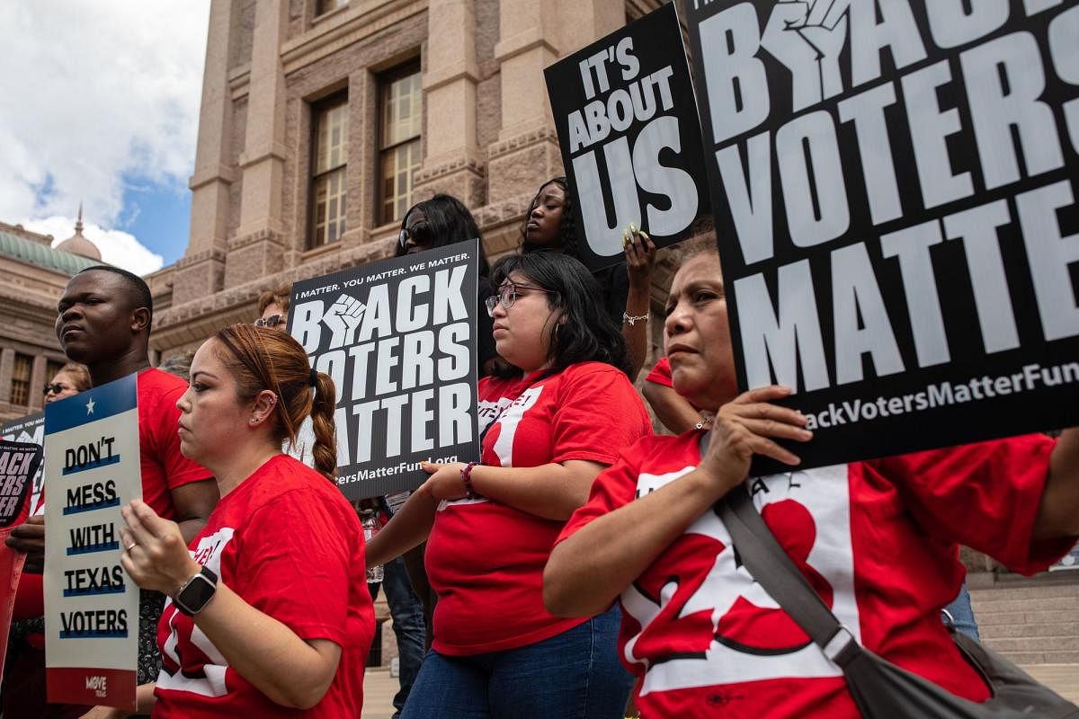 Demonstrators are gathered outside of the Texas State Capitol during a voting rights rally on the first day of the 87th Legislature's special session on July 8, 2021 in Austin, Texas. Republican Gov. Greg Abbott called the legislature into a special session, asking lawmakers to prioritize his agenda items that include overhauling the states voting laws, bail reform, border security, social media censorship, and critical race theory. Credit: AFP Photo