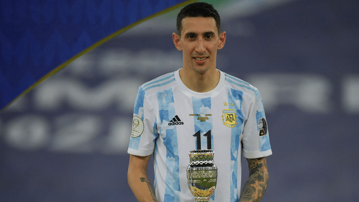 Argentina's Angel Di Maria holds the match's MVP trophy after winning the Conmebol 2021 Copa America. Credit: AFP Photo