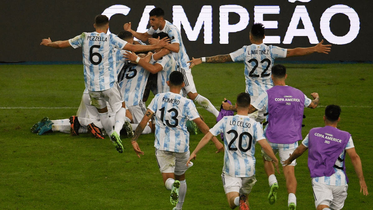 Players of Argentina celebrate after winning the Conmebol 2021 Copa America football tournament final match against Brazil. Credit: AFP Photo