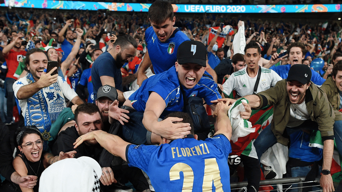 Italy's Alessandro Florenzi celebrates after winning Euro 2020 after a penalty shootout. Credit: Reuters Photo