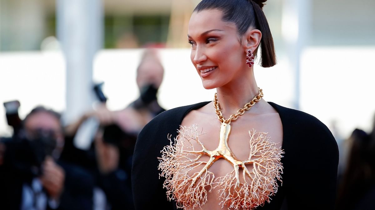 Bella Hadid looks stunning a topless black gown with a jaw-dropping lung necklace covering her breasts. Credit: Reuters Photo