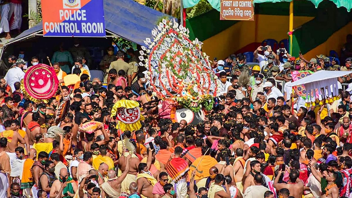 Amidst beating of cymbals, blowing of conch shells and chanting of 'Hari Bol', Lord Jagannath and his celestial siblings' devotee-less Ratha Jatra was held in Odisha's Puri on Monday with strict adherence to Covid-19 protocols as the entire coastal town was put under curfew.