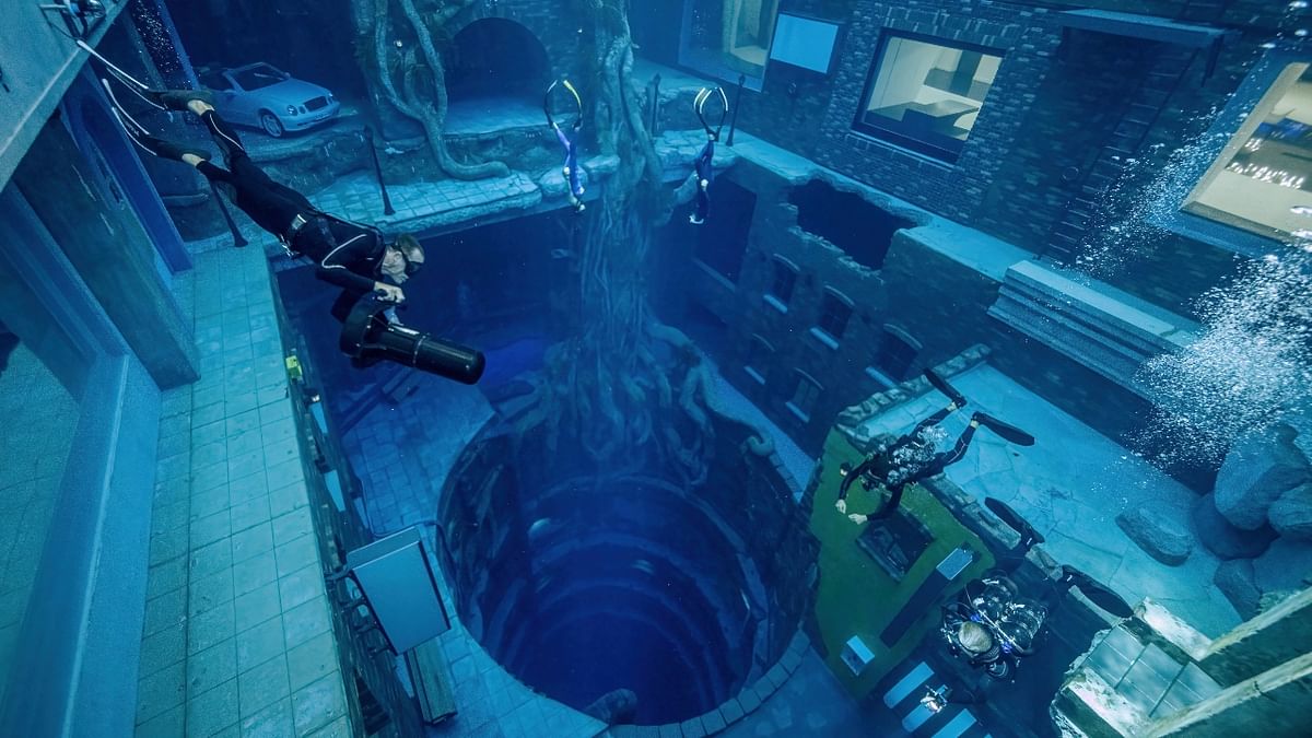 The world's deepest swimming pool for underwater diving has opened in Dubai, where people can descend 60 metres (197 ft) to a sunken city-themed landscape and play arcade games. Credit: Reuters Photo