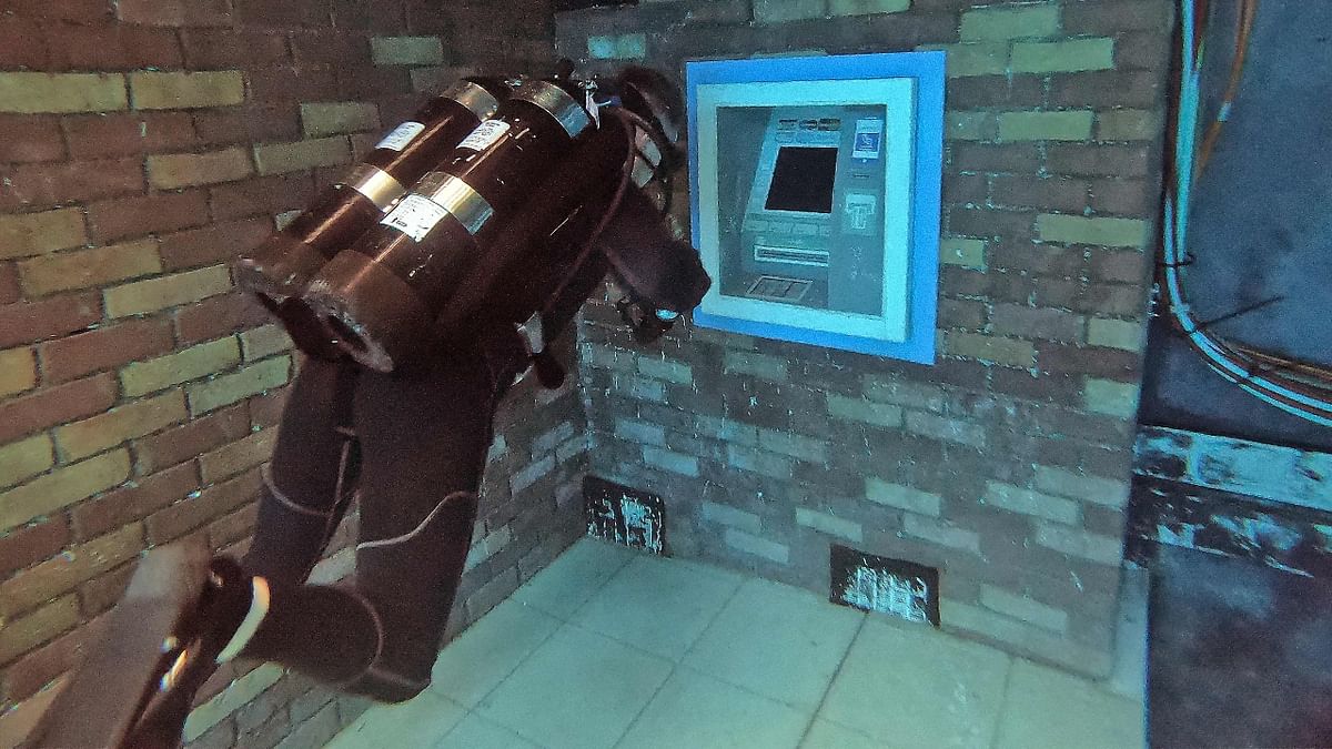 A diver is seen exploring an ATM at the Deep Dive Dubai in UAE. Credit: AFP Photo