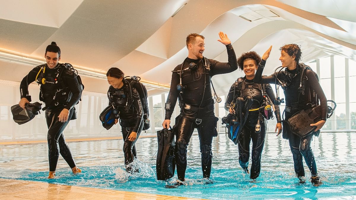 Scuba divers at the Deep Dive Dubai, the deepest pool in the world, in Dubai, United Arab Emirates. Credit: Deep Dive Dubai/Handout via Reuters