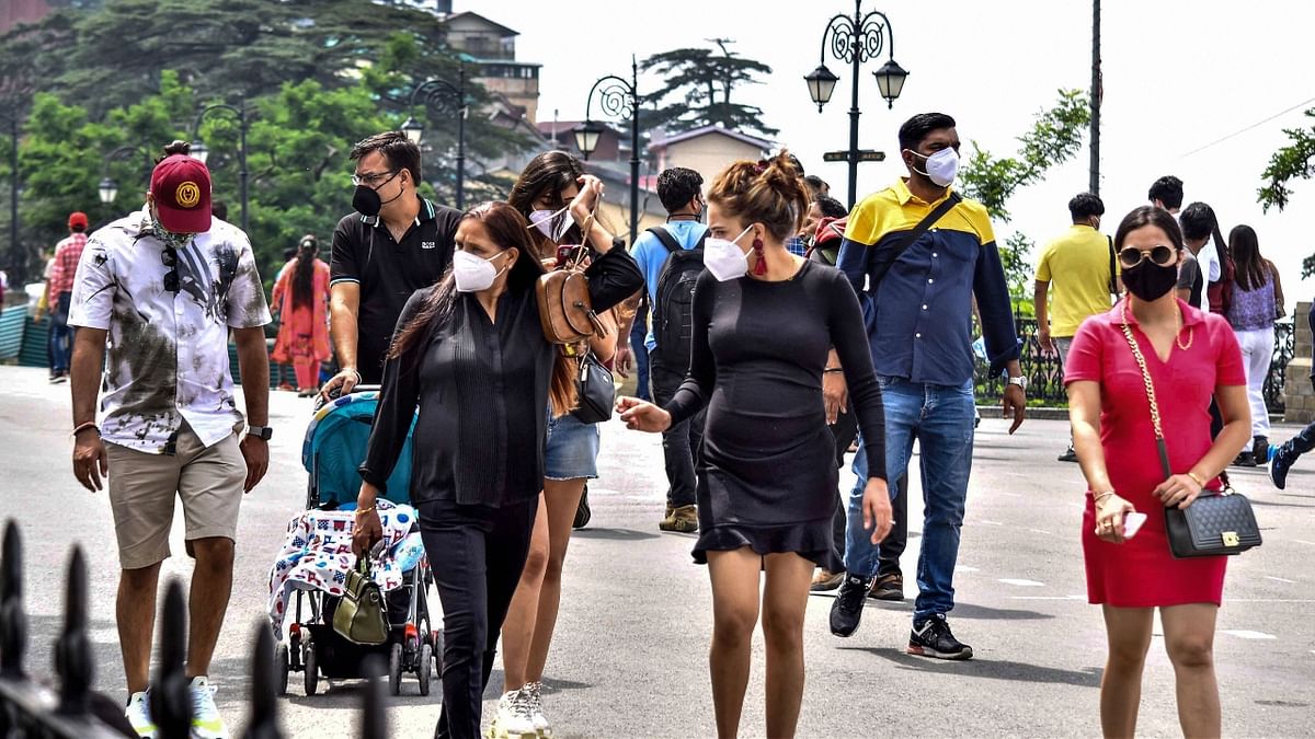 Tourists at the Ridge Road after further ease in Covid-induced lockdown restrictions in Shimla. Credit: PTI Photo